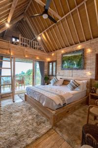 a large bedroom with a large bed in a room at Garden Terrace Bali in Gobleg