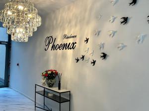 a wall with butterflies and a sign on it at luxury in Mons