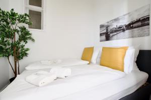 En eller flere senge i et værelse på Premium Apartment by Hi5- Bródy street