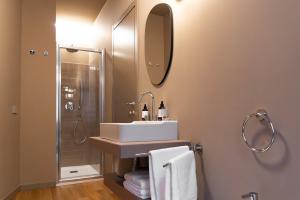 a bathroom with a sink and a shower at Cà Bèla - Certosa in Milan