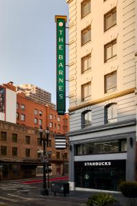 a hotel sign on the side of a building at The Barnes San Francisco, Tapestry Collection by Hilton in San Francisco