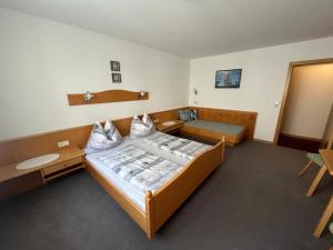 Ένα ή περισσότερα κρεβάτια σε δωμάτιο στο Appartement Riepler