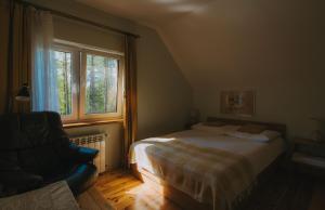 Posteľ alebo postele v izbe v ubytovaní Domek Leśny nad Tanwią