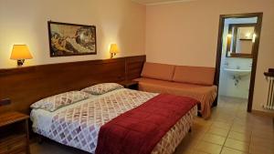 a hotel room with a bed and a sink at Villa Celeste in Rocca Pia