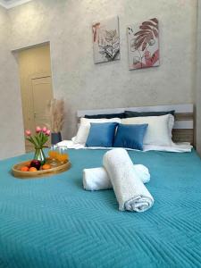 Postel nebo postele na pokoji v ubytování Уютная квартира на левом берегу Астаны