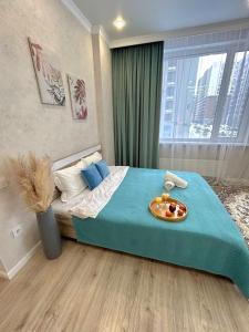 Postel nebo postele na pokoji v ubytování Уютная квартира на левом берегу Астаны