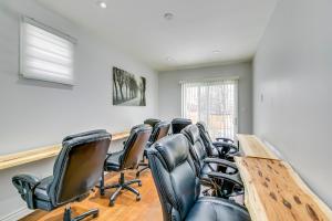 a conference room with a long table and leather chairs at Tranquil Oasis in Lakeview in Mississauga