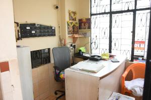 a kitchen with a desk with a laptop on it at Hotel Park, Thiruvannamalai in Tiruvannāmalai