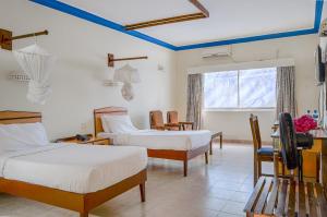 Postel nebo postele na pokoji v ubytování Sai Rock Beach Hotel & Spa + 37 fotografií