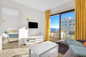 a large living room with a view of the ocean at Ocean House 1713 By IVI Real Estate in Torremolinos