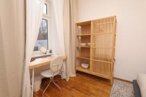 a home office with a desk and a window at Ruby holiday home with patio in Vienna