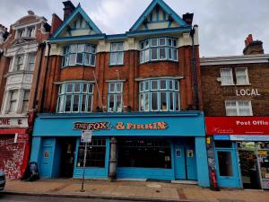 a building on the corner of a street at Firkinn in London