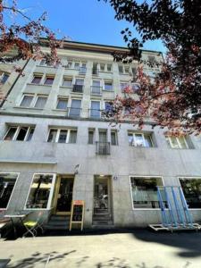a large stone building with a lot of windows at Urban Oasis with Queen Bed and View BE-19 in Zürich
