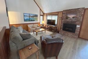 a living room with a couch and a fireplace at Brookstone Pines home in Incline Village