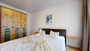 Postel nebo postele na pokoji v ubytování Apartmenthaus Binzer Sterne Haus 1