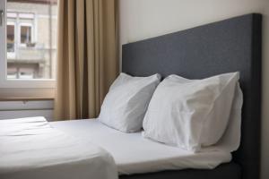 Postelja oz. postelje v sobi nastanitve Urban Oasis with Queen Bed and View BE-48