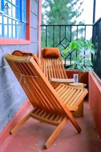 a wooden bench sitting on a porch at Arctic Tern airbnb Mwea 