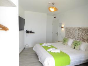 Lua Hotel Boutique客房内的一张或多张床位
