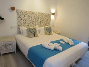 Lua Hotel Boutique客房内的一张或多张床位