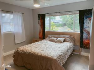 a bedroom with a bed with two pillows on it at A home away from home in Orlando