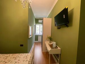 Μια τηλεόραση ή/και κέντρο ψυχαγωγίας στο Bed and breakfast Stella