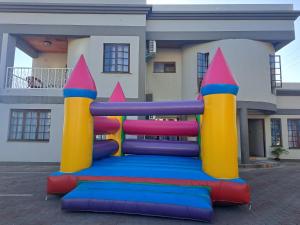 a inflatable playground in front of a building at LOTUS LODGE in Gaborone