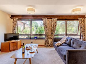 a living room with a couch and a tv at 2 bed property in Cleobury Mortimer 90642 in Hopton Wafers