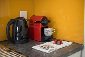 Coffee and tea making facilities at Downtown Deluxe Studio with Queen Bed BE-55