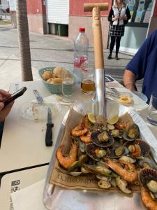 a plate of shrimp and seafood on a table at vivienda vacacional Atlantida in Candelaria