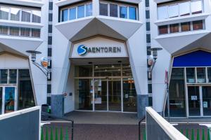 a building with a sign that reads santander at easyHotel Amsterdam Zaandam in Zaandam