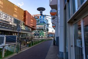 an empty street in a city with tall buildings at easyHotel Amsterdam Zaandam in Zaandam