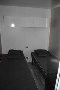 Postel nebo postele na pokoji v ubytování Riva Bella chez Caraphou