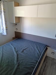 Postel nebo postele na pokoji v ubytování Riva Bella chez Caraphou