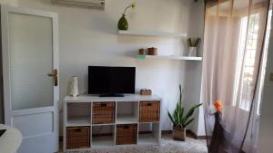 TV a/nebo společenská místnost v ubytování A'MA CASA + 9 fotografií