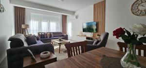 Posezení v ubytování Value Living Apartment