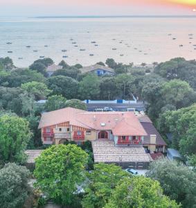 an aerial view of a house with trees at La Guitoune in Pyla-sur-Mer