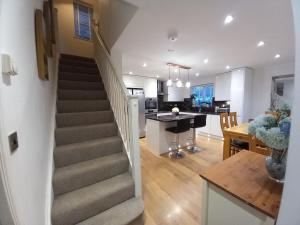 a staircase leading to a kitchen and a living room at Turners Escape in Dinnington