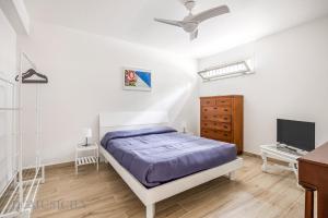 En eller flere senge i et værelse på La Dimora del Mare by Domus Sicily