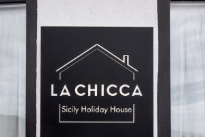a sign for a facility holly holiday house at La Chicca Sicily Holiday House in Castelmola