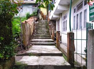a set of stairs leading up to a building at Hotel Ava INN in Darjeeling