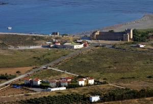 an aerial view of a small town next to the ocean at Monachus Monachus in Frangokastello
