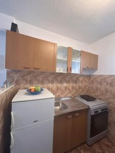 Kuchyň nebo kuchyňský kout v ubytování Apartments Valjan