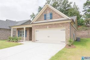 a brick house with a white garage at NEW Charming Escape 3 BD King Suite East of Birmingham 