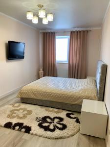 Posteľ alebo postele v izbe v ubytovaní River Apartments