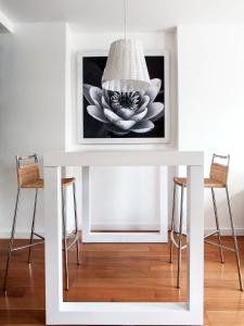 a white table with a picture of a flower on it at Casa Bevant in Buenos Aires