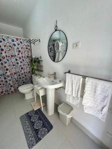 a bathroom with a sink and a toilet and a mirror at La dolce vita in Mala +14 photos