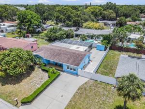 an overhead view of a house with solar panels on the roof at Ocean Blue Heated Pool Home in Largo