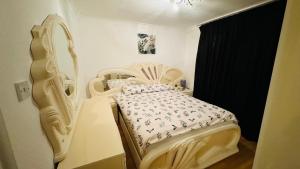 a bedroom with a white bed in a room at Double room in Greater London (Hackney) in London