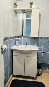 a bathroom with a white sink and a mirror at Double room in Greater London (Hackney) in London