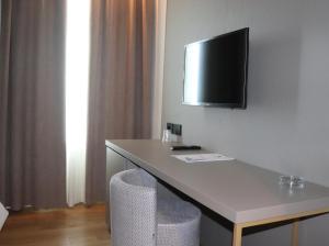 TV a/nebo společenská místnost v ubytování Vittoria Parc Hotel